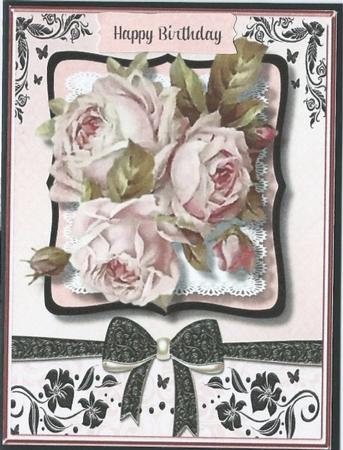 Lovely Roses on a Black and Pink Bracket  by Rhonda Young