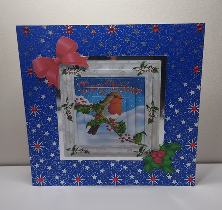A Lovely robin on a branch with snow and berries square pyramids by Roseanna Miles