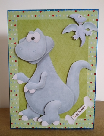 Big Blue Dinosaur in Green Spotty Frame A4 by Roseanna Miles