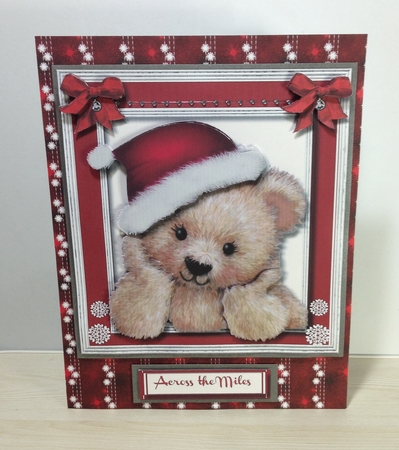 Fuzzy Bear in His Christmas Hat  by Roseanna Miles