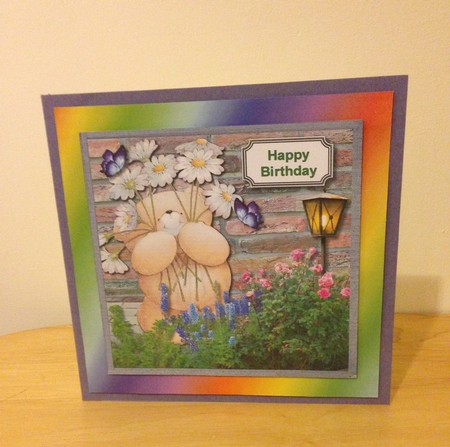 Forever friends bear in flower garden by Roseanna Miles