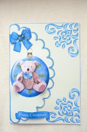 Cute Christmas Teddy in a Bauble with Blue Bow by Rosina Walker