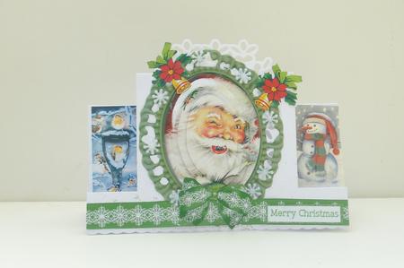 Jolly Santa in Ornate Frame Oval Pyramids by Rosina Walker