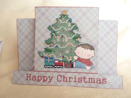 Little Boy Playing with His New Train Set Christmas Stagger by Rosina Walker