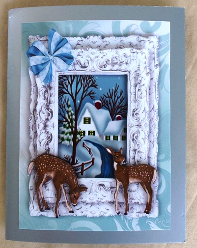 Deers with Snow Scene and Cottage in Silver Frame A4 by Ruth Taylor