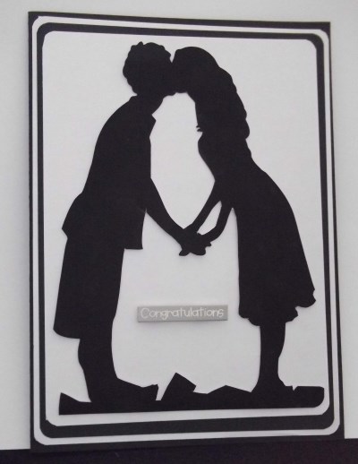 Kissing Couple Silohette by Sally Hickling