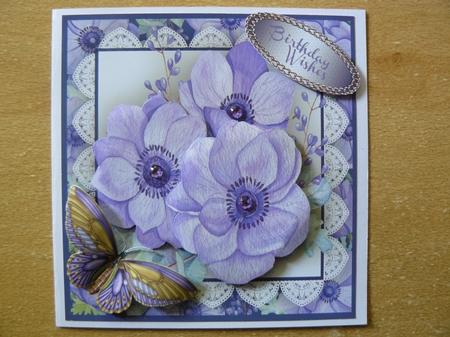 Beautiful Lilac Anemones on lace  by Sandy Kingdon