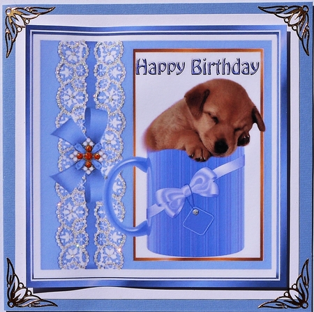 Cute little puppy sleeping in a mug with blue bow 8x8 by Selina Dittmann