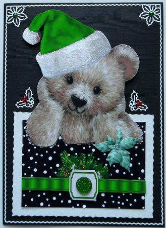Little Fuzzy Bear in Green Santa Hat with Bow Over the Edge by Selina Dittmann