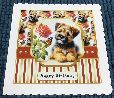 puppy dog border terrier with flowers and butterfly  by Sharron Hylton