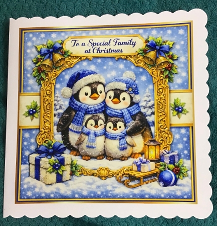 penguin family at christmas by Sharron Hylton