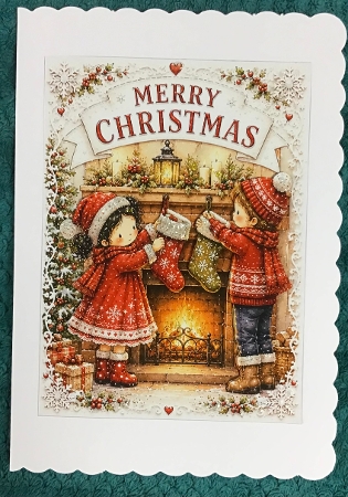 lucy and george hangng stockings fireplace by Sharron Hylton