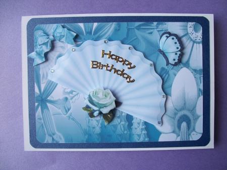 Pretty Ladies Fan on Blue Flower Abstract Background by Sheila Horne