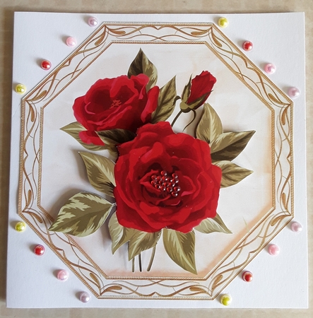 Pretty red roses in ornate toppers by Shirley Taylor