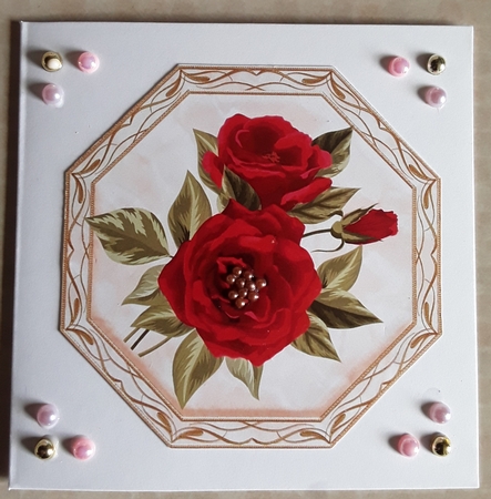 Pretty red roses in ornate toppers by Shirley Taylor