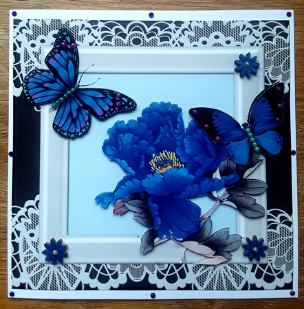 Pretty blue exotic flower with pretty butterflies in ornate frame 7x7 by Shirley Taylor