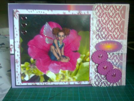 Tomboy Flower Fairy Sitting in Pink Petunia Featured Gallery Photo