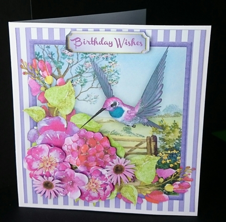Beautiful Hummingbird and Spring flowers  by Sue Soules