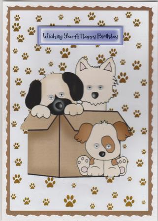 Cute Little Puppies in a Box with Flowers by Susan Cummings
