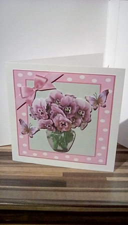 Pretty pink pansies in a vase in 7x7 polkadot frame by Susan Lapornik