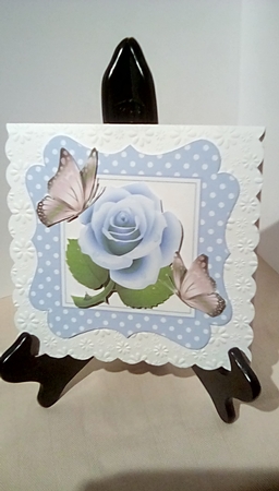 Pretty in blue polkadot 7x7 frame with blue roses by Susan Lapornik