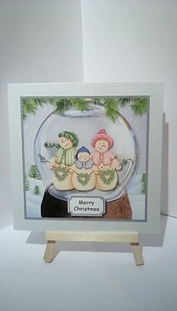 Snow globe with snow family by Susan Lapornik