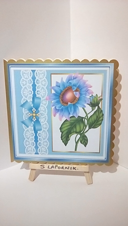 Turq with lace border and bow with rainbow sunflower 8x8 card front by Susan Lapornik