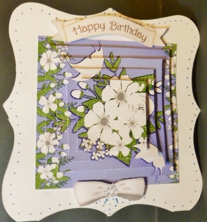 Pretty purple and white flowers with butterflies pyramids by Susan Powell-Barton