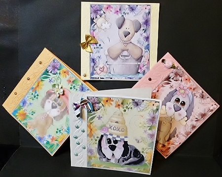 4 cute floral puppy toppers by Susan Powell-Barton
