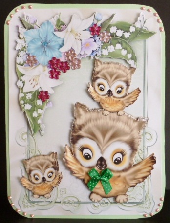 Family of Owls Playing, in Floral Frame by Susan Powell-Barton