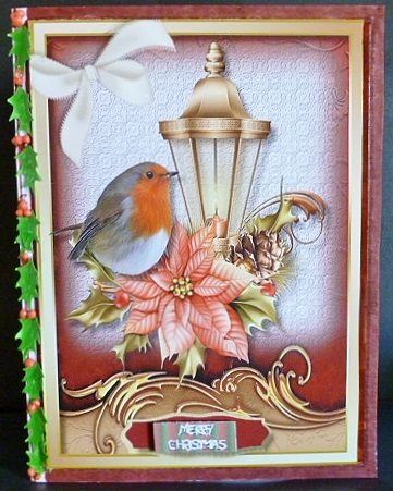 Beautiful Robin on a Christmas Lamp by Susan Powell-Barton