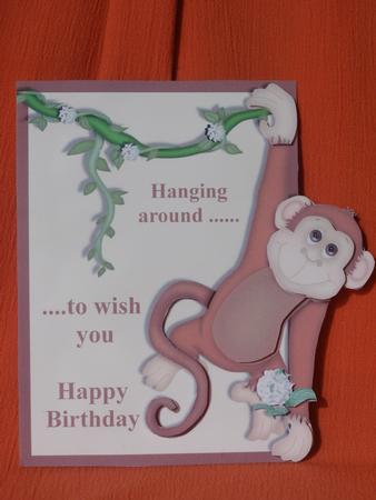 Monkey Over the Edge Birthday Card Front by Susan Smith