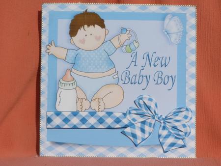 A New Baby Boy with Rattle and Big Bow by Susan Smith