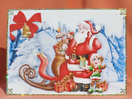 Santa with His Little Elf and Toys in the Snow by Susan Smith