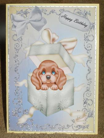 Cute Brown Puppy in a Gift Box by Susan Smith