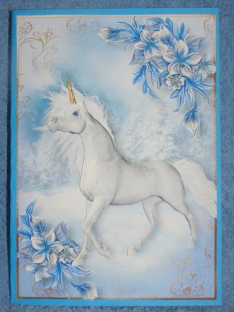 The Snow Unicorn & Winter Flowers by Susan Smith