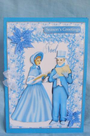Carol Singers, with Blue Poinsettias by Susan Smith
