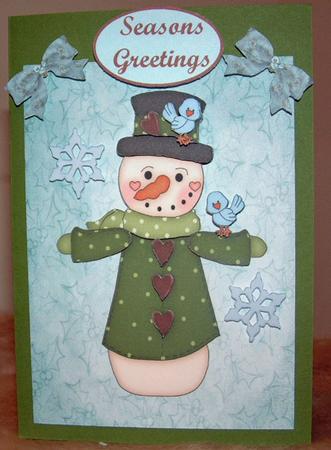 Blue Snowman with Birds by Susan Wellhausen