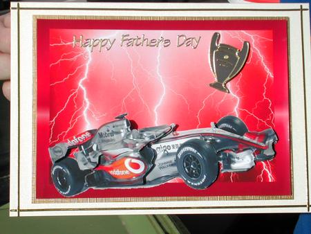 Fire Red Formula 1 Race Car on Lightning Background 2 of 2 by Susan Heanes