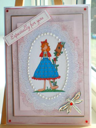 Garden Girl with Bird House on Lace by Suzanne Burrows
