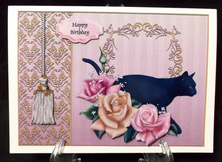 Black cat in the roses by Suzi Cooper