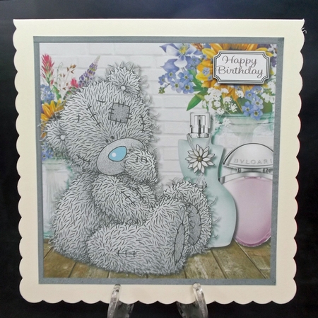 Tatty teddy with flowers and perfume by Suzi Cooper