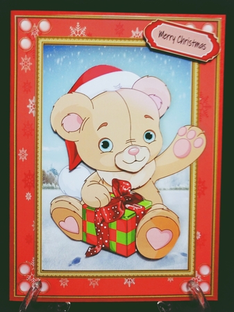Gorgeous Christmas Teddy Bear In Red Snowflake Frame by Suzi Cooper