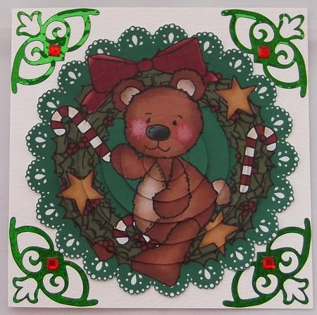 Christmas Teddy on a Green Lace Background by Suzi Cooper