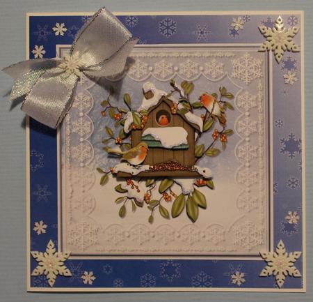 Robins on Snowflake Lace Background by Taina Kankare