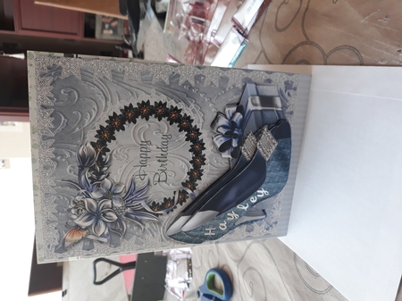 Shoes, Present, Butterfly and Winter Flowers Birthday Card by Teresa Lunn