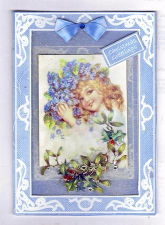 Chistmas Girl with Forget-me-nots and Holly by Teresa Savin