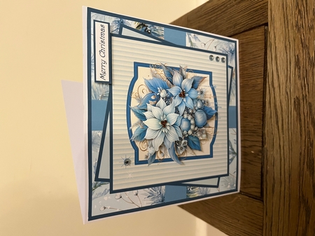 Blue poinsettia and baubles 7x7 by Tina Fair