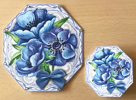 Stunning Blue Anemonies on lace  by Ulla Skraedderdal