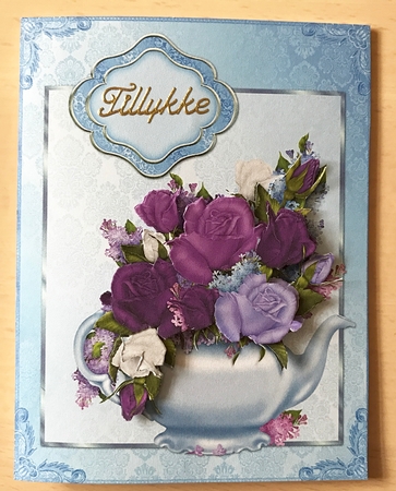 Blue teapot and purple roses by Ulla Skraedderdal